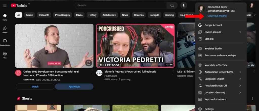 Homepage of youtube and an arrow is pointing to the top right corner of the screen for changing the banner